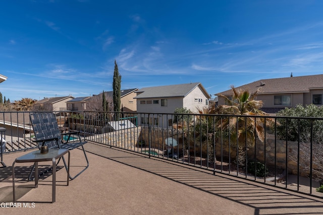 view of patio / terrace featuring a residential view and a balcony