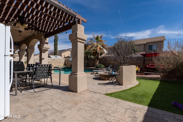 view of patio / terrace with a fenced backyard, an outdoor pool, and a pergola