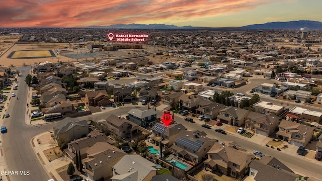 3612 Tierra Calida Dr, El Paso, TX 79938 - aerial view at dusk featuring a residential view and a mountain view