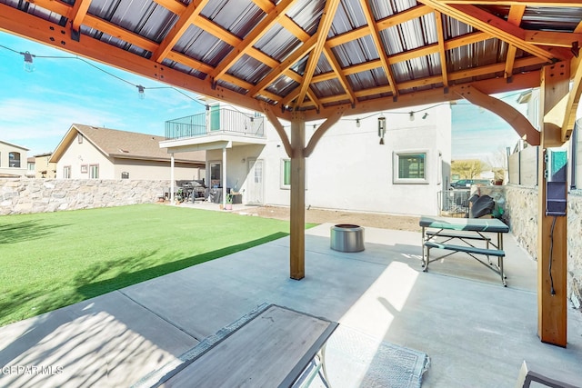 view of patio / terrace featuring fence, a balcony, and a gazebo