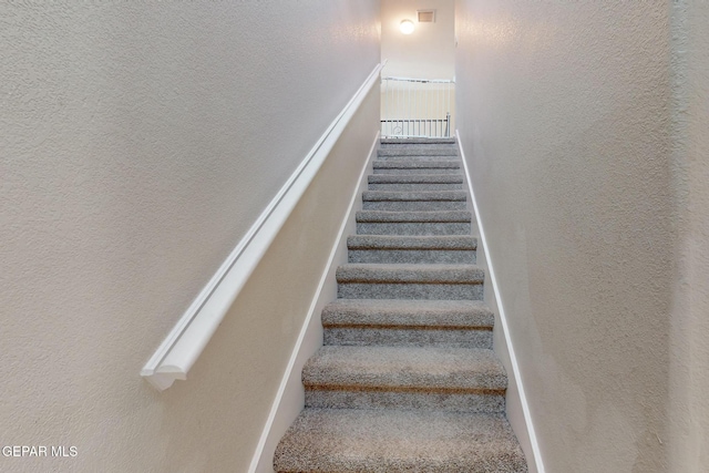 stairs with a textured wall