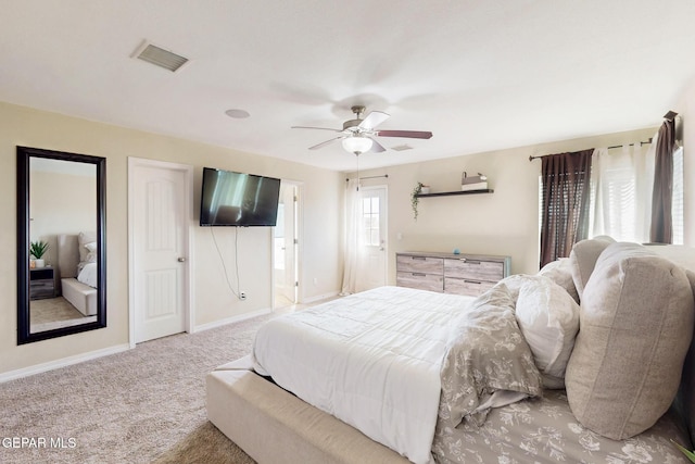 bedroom featuring a ceiling fan, baseboards, visible vents, and carpet flooring