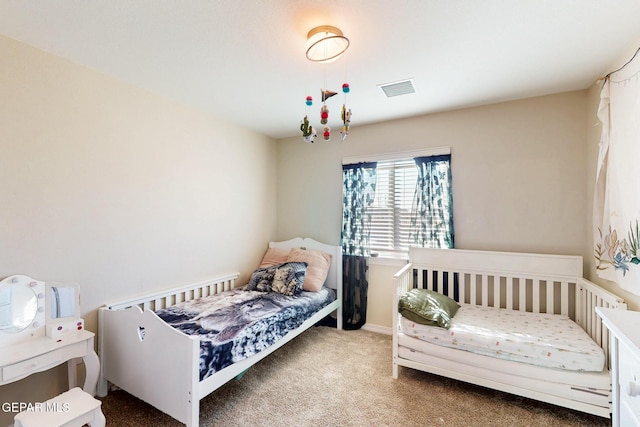 bedroom featuring carpet, visible vents, and baseboards