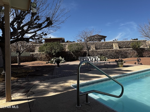 view of pool with a patio area, a fenced backyard, and a fenced in pool