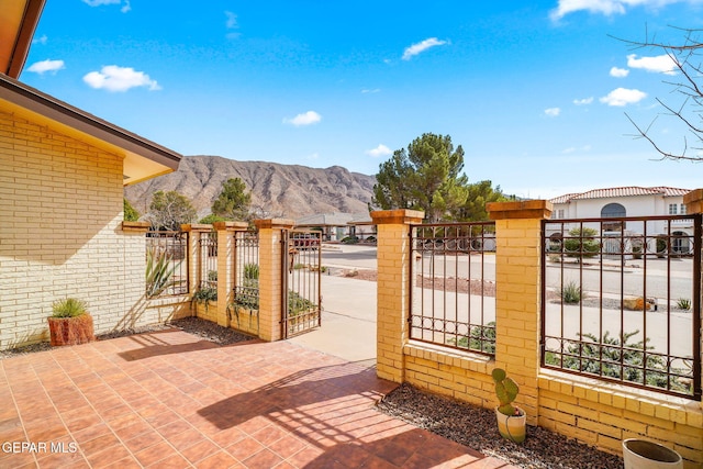 425 Golden Springs Dr, El Paso, TX 79912 - view of gate featuring fence and a mountain view
