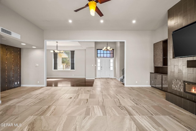 425 Golden Springs Dr, El Paso, TX 79912 - unfurnished living room with ceiling fan with notable chandelier, recessed lighting, visible vents, and baseboards