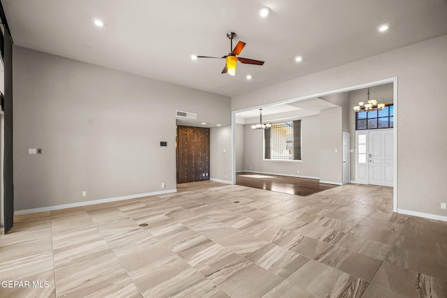 425 Golden Springs Dr, El Paso, TX 79912 - unfurnished living room featuring recessed lighting, baseboards, visible vents, and ceiling fan with notable chandelier