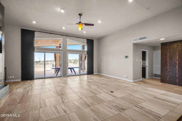 425 Golden Springs Dr, El Paso, TX 79912 - interior space featuring visible vents, a fireplace with raised hearth, baseboards, ceiling fan, and recessed lighting