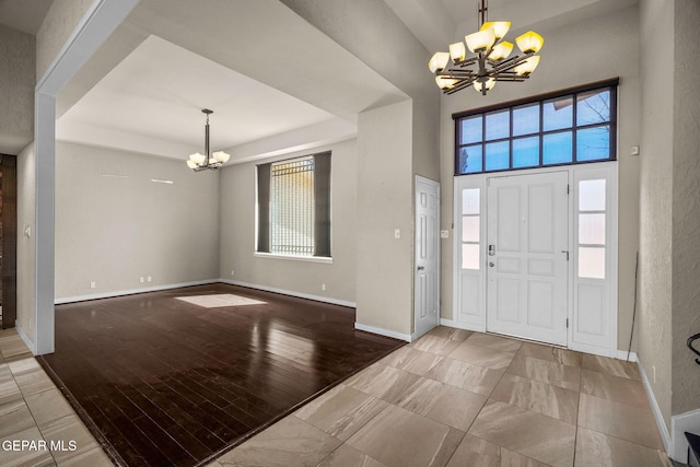 425 Golden Springs Dr, El Paso, TX 79912 - foyer featuring baseboards, a chandelier, and wood finished floors