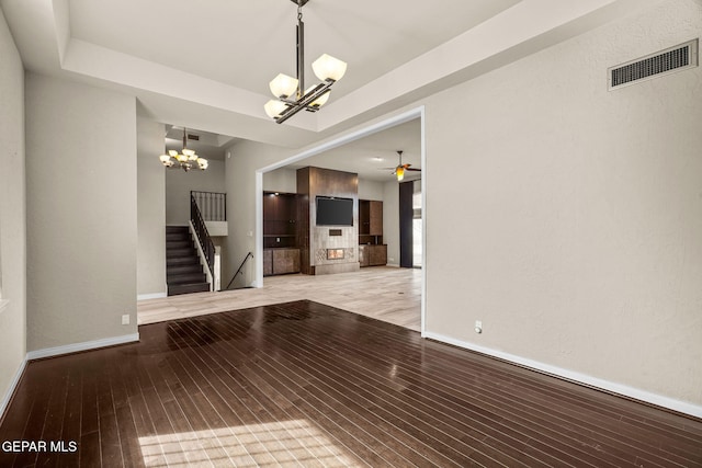 425 Golden Springs Dr, El Paso, TX 79912 - empty room featuring baseboards, stairway, visible vents, and light wood-style floors