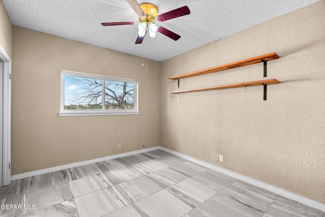 425 Golden Springs Dr, El Paso, TX 79912 - unfurnished room with a textured wall, a textured ceiling, and baseboards