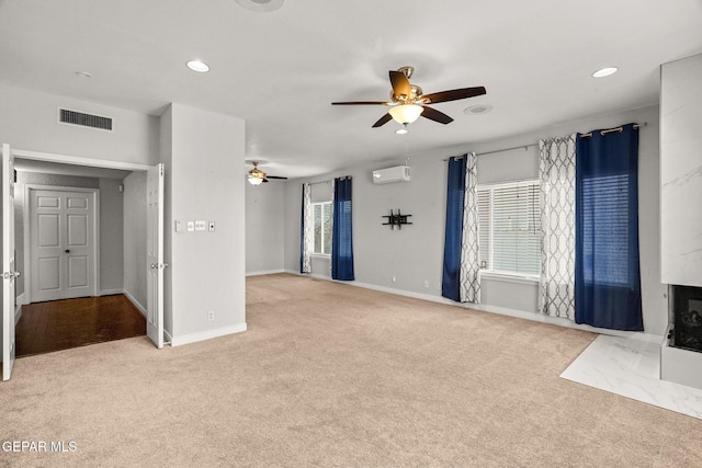 425 Golden Springs Dr, El Paso, TX 79912 - unfurnished living room with a wall mounted AC, recessed lighting, visible vents, and light colored carpet