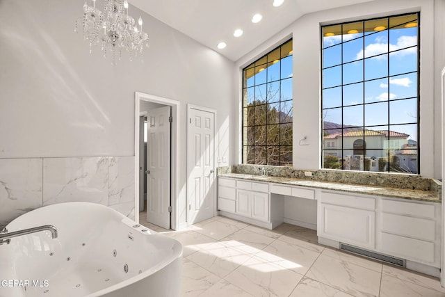425 Golden Springs Dr, El Paso, TX 79912 - full bathroom featuring high vaulted ceiling, a freestanding tub, vanity, visible vents, and marble finish floor