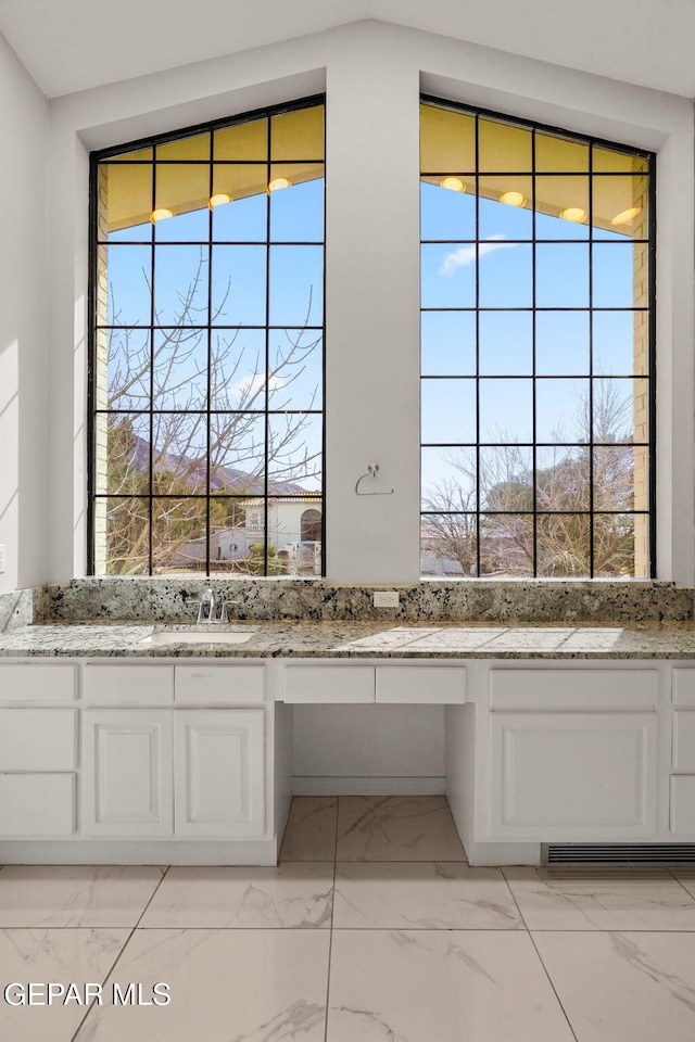 425 Golden Springs Dr, El Paso, TX 79912 - interior details featuring built in desk and a sink