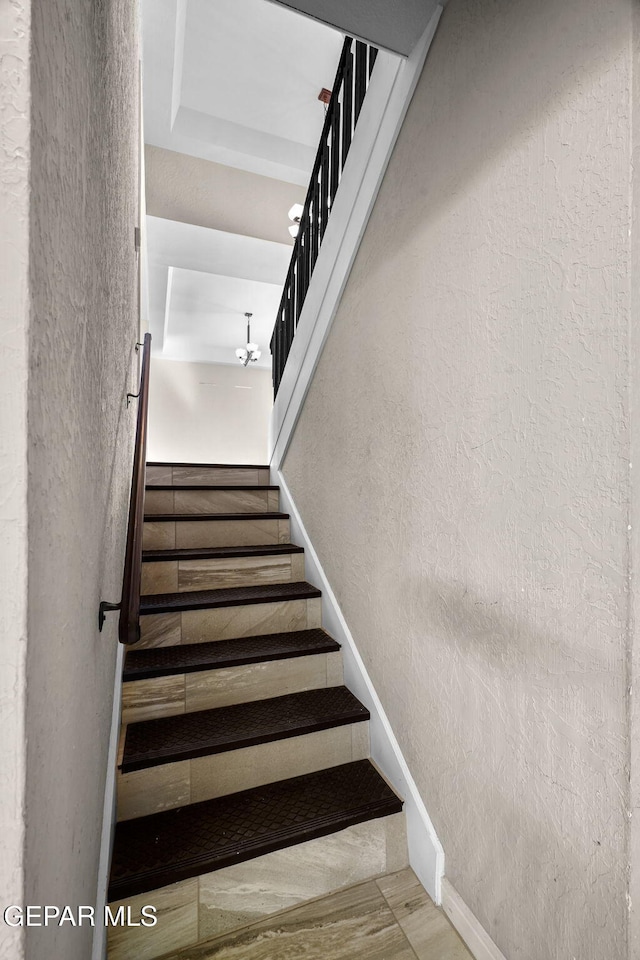 425 Golden Springs Dr, El Paso, TX 79912 - staircase featuring a textured wall and baseboards