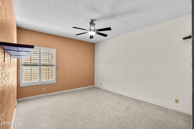 425 Golden Springs Dr, El Paso, TX 79912 - empty room featuring a textured wall, a ceiling fan, a textured ceiling, and light colored carpet