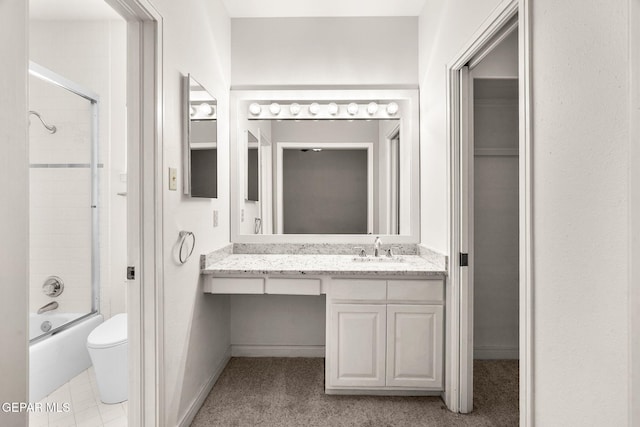 425 Golden Springs Dr, El Paso, TX 79912 - full bathroom featuring baseboards, shower / bath combination with glass door, vanity, and toilet