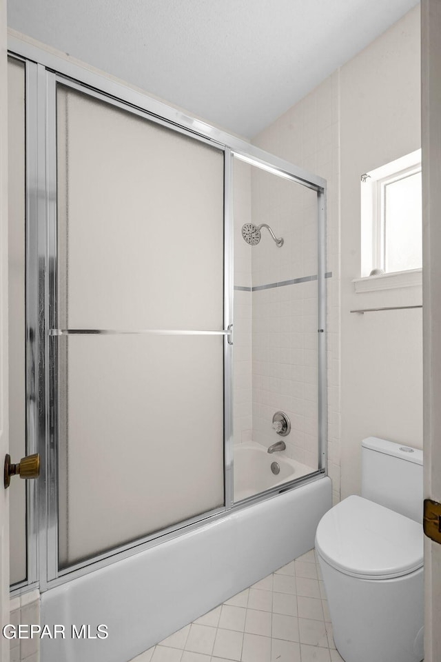 425 Golden Springs Dr, El Paso, TX 79912 - full bath featuring toilet, combined bath / shower with glass door, and tile patterned floors