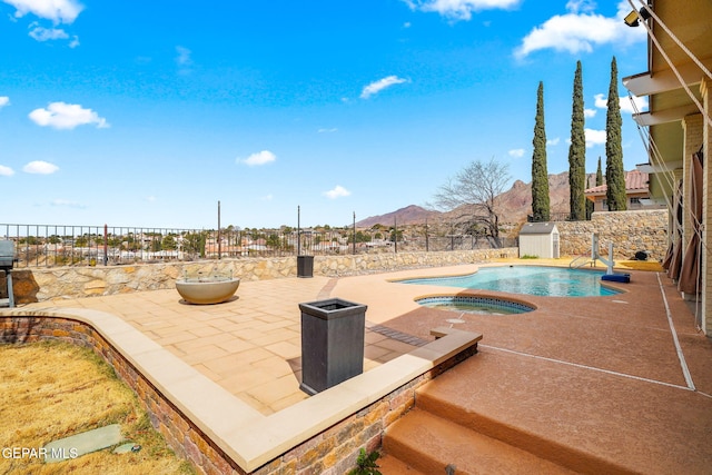 425 Golden Springs Dr, El Paso, TX 79912 - view of pool featuring a fenced in pool, a patio, a fenced backyard, an in ground hot tub, and a mountain view