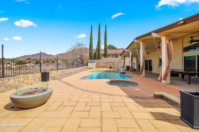 425 Golden Springs Dr, El Paso, TX 79912 - view of pool with an in ground hot tub, a patio, a fenced backyard, and a mountain view