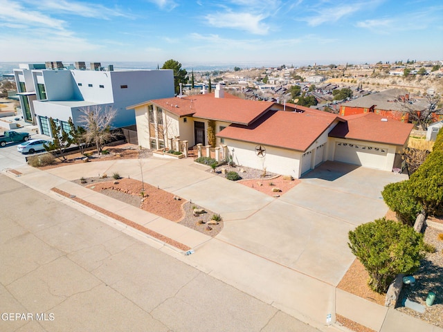 425 Golden Springs Dr, El Paso, TX 79912 - view of front of property featuring a residential view, concrete driveway, and stucco siding