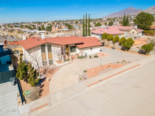 425 Golden Springs Dr, El Paso, TX 79912 - view of front facade with driveway, a residential view, and a mountain view