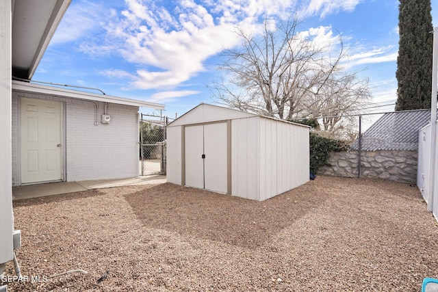 view of shed with fence