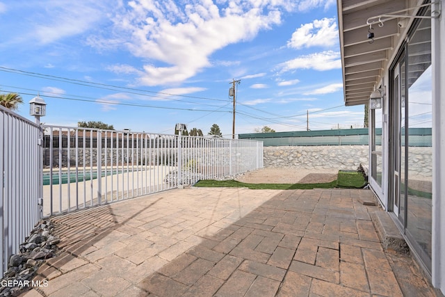 view of patio / terrace featuring fence and a fenced in pool