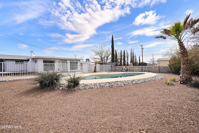 view of swimming pool with a patio area, a fenced backyard, and a fenced in pool