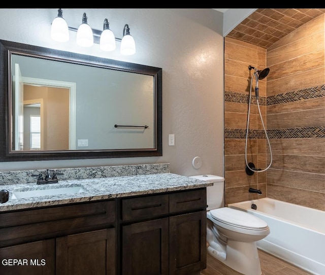 bathroom with toilet, wood finished floors, vanity, brick ceiling, and  shower combination