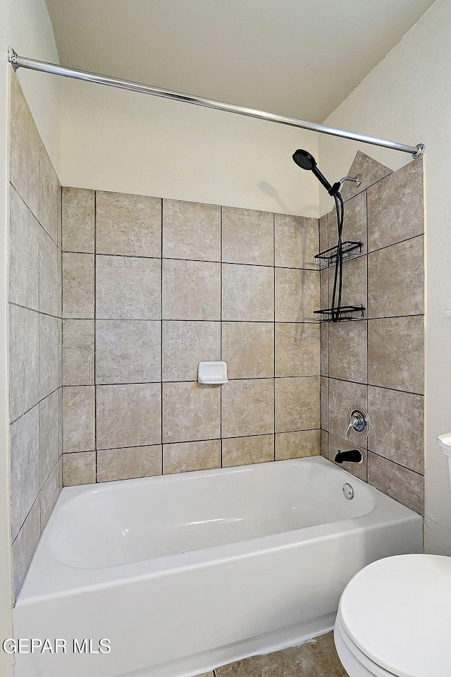 full bath featuring bathing tub / shower combination and toilet