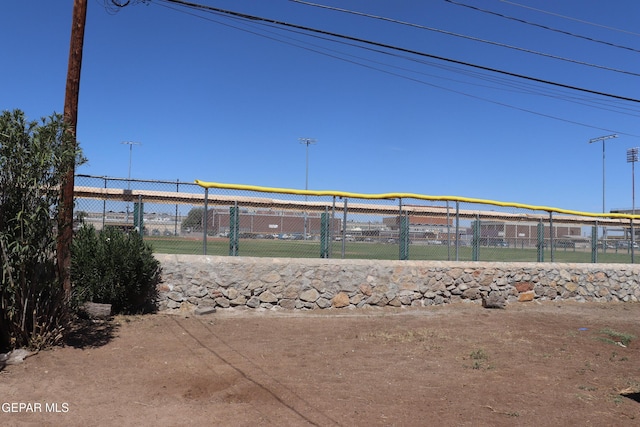 view of property's community featuring fence