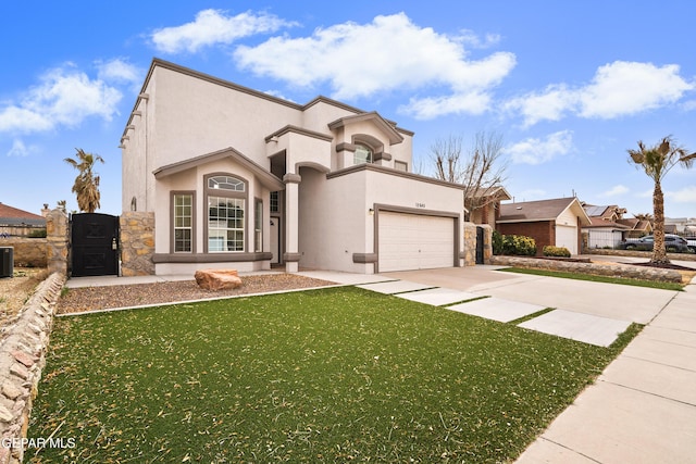 mediterranean / spanish-style house with stucco siding, concrete driveway, a front yard, a gate, and a garage