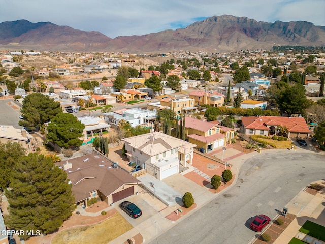 birds eye view of property with a residential view and a mountain view