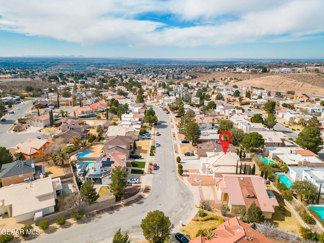 birds eye view of property with a residential view