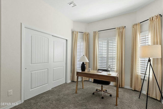 carpeted home office featuring baseboards and visible vents