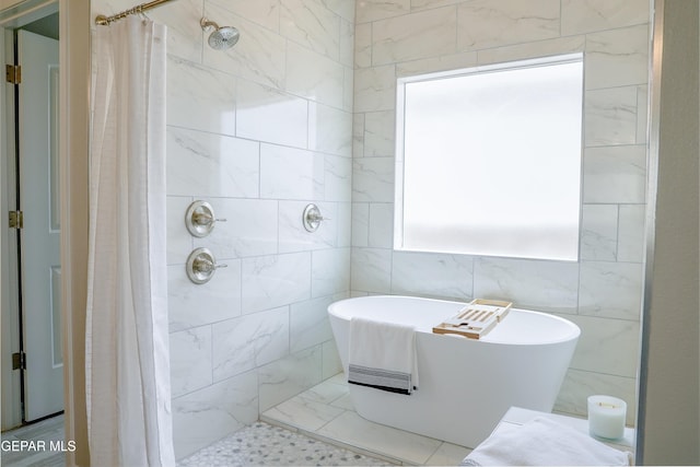 3853 Surmise St, El Paso, TX 79938 - bathroom featuring a freestanding tub and a tile shower