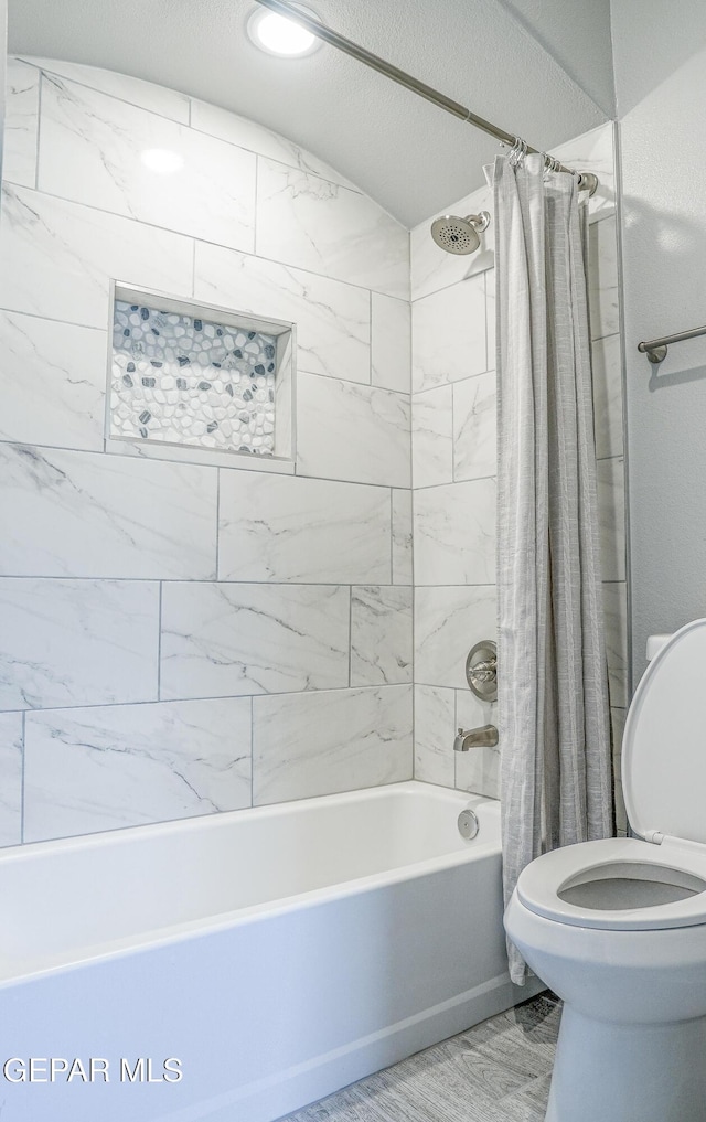 3853 Surmise St, El Paso, TX 79938 - bathroom featuring shower / tub combo with curtain and toilet