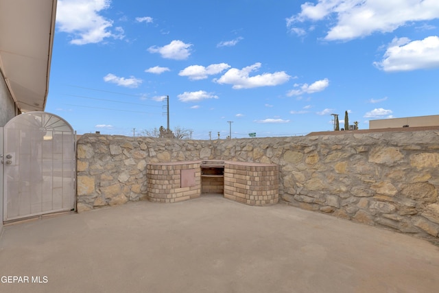 view of patio / terrace with a gate