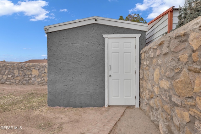 view of shed with fence