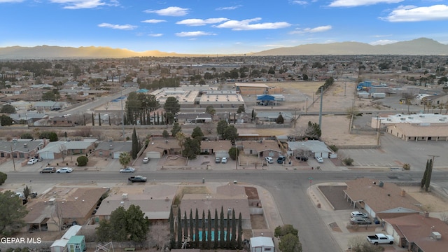 drone / aerial view featuring a residential view and a mountain view