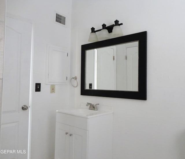 bathroom featuring vanity and visible vents