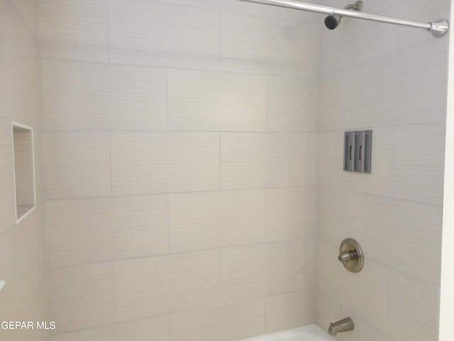 full bath featuring shower / tub combination