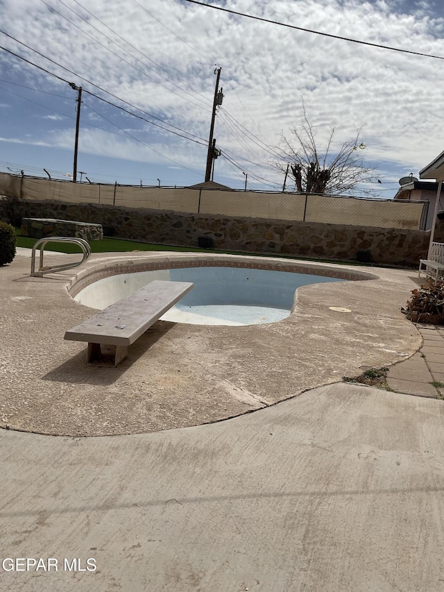 view of pool with a patio area, fence, and a fenced in pool