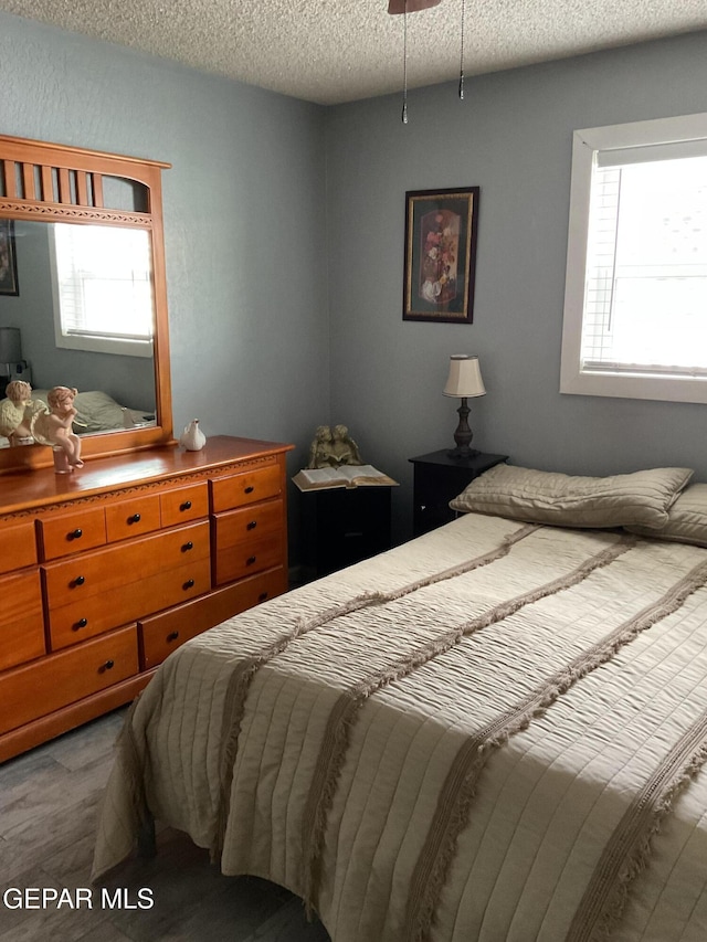 bedroom featuring a textured ceiling