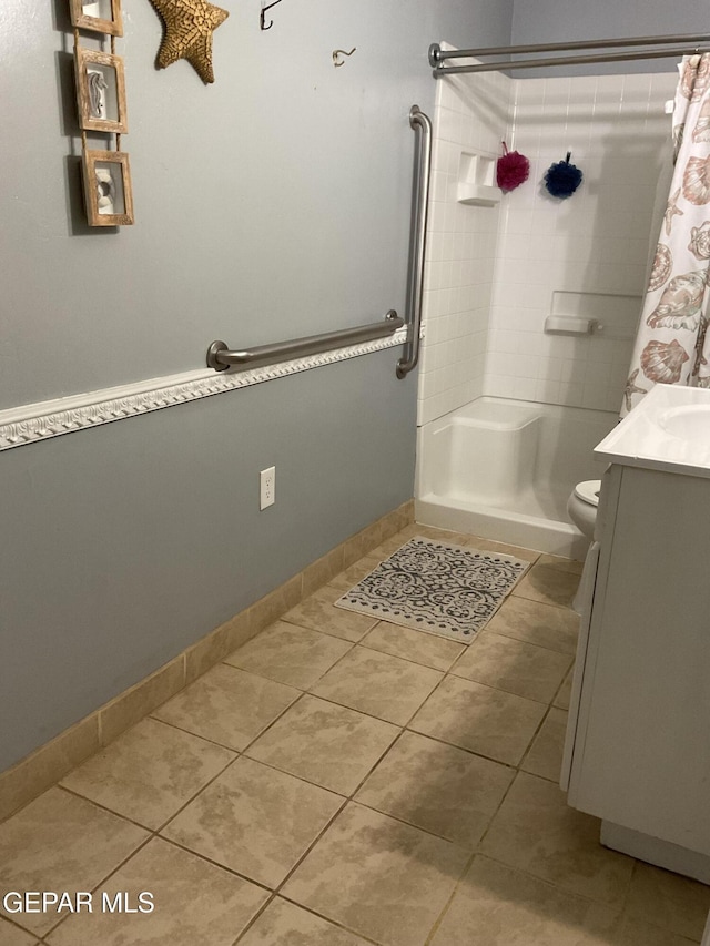 full bathroom featuring a shower with curtain, tile patterned flooring, and toilet