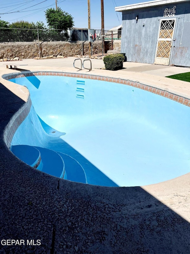 view of pool featuring fence and a fenced in pool