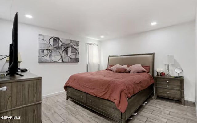 bedroom featuring baseboards, recessed lighting, and wood tiled floor