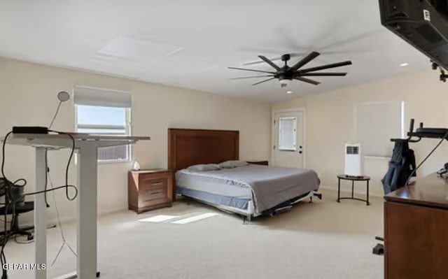 carpeted bedroom with ceiling fan