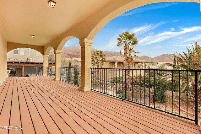 wooden terrace with a mountain view